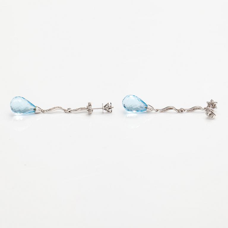 A pair of 18K white gold earrings with topazes and diamonds ca. 0.37 ct in total.