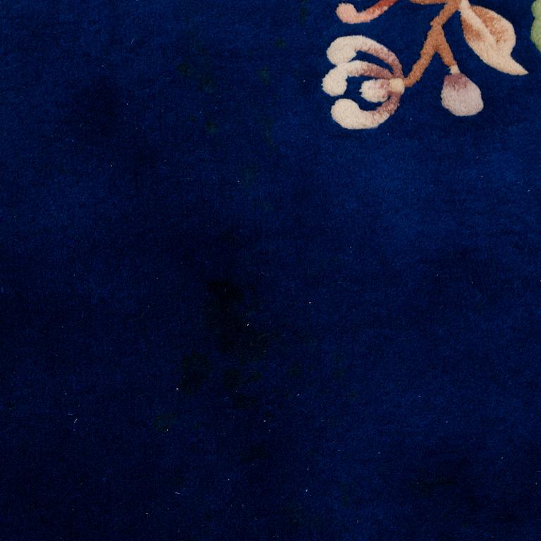 A CARPET, China, ca 304,5 x 242,5 cm (as well as 3 cm flat weave at the ends).