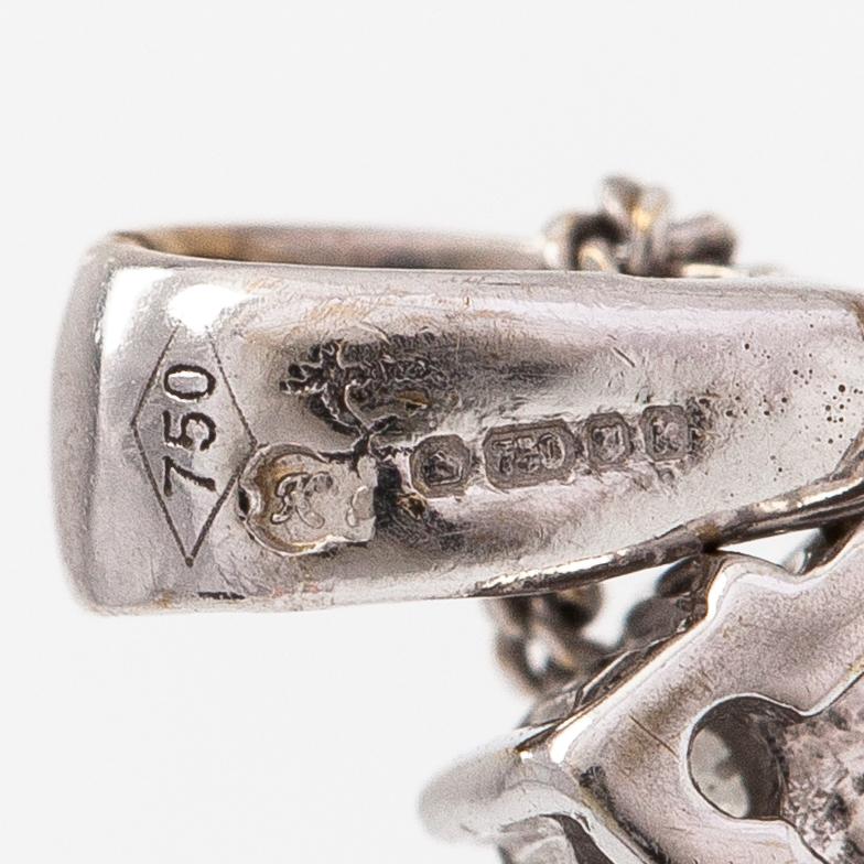 Kaulakoru, 18K valkokultaa ja timantteja n. 0.56 ct yht.
