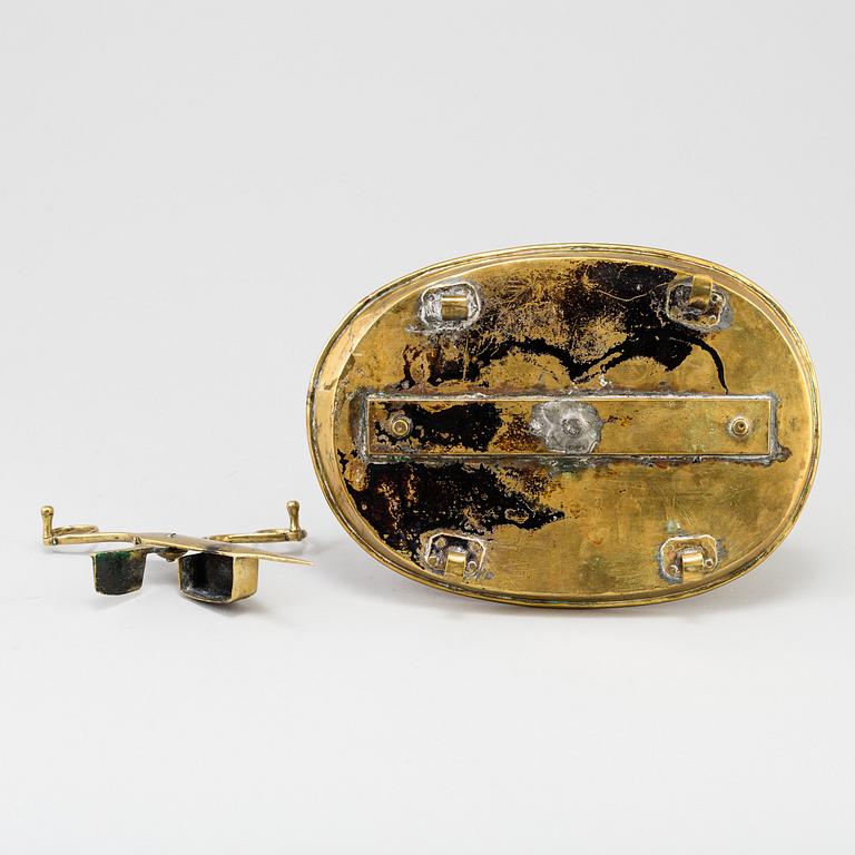 A 19th century bra candleholder for two candles and candle wick-trimming scissors.