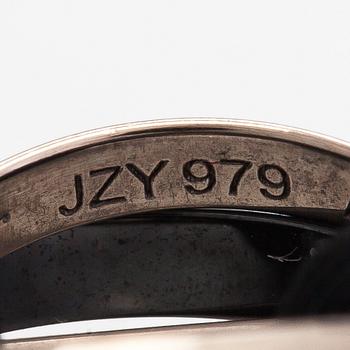 Cartier, A "Trinity" bracelet made of 18K white gold, ceramic and textile. Marked Cartier, JZY979.