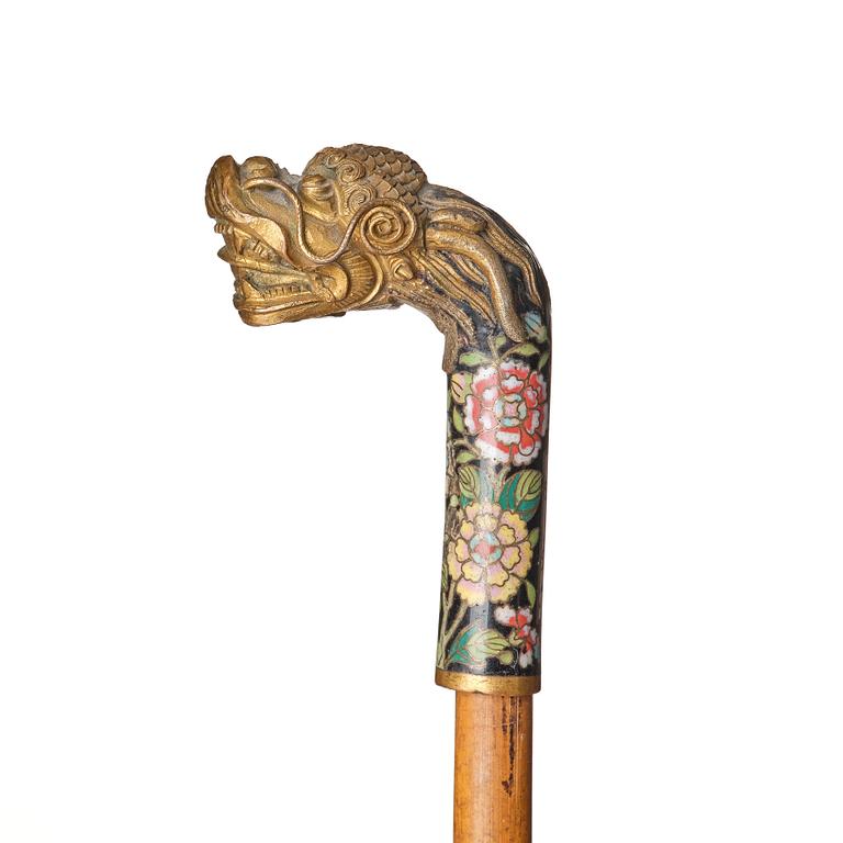 A Chinese bamboo walking cane with a cloisonné handle, late Qing dynasty/early 20th Century.