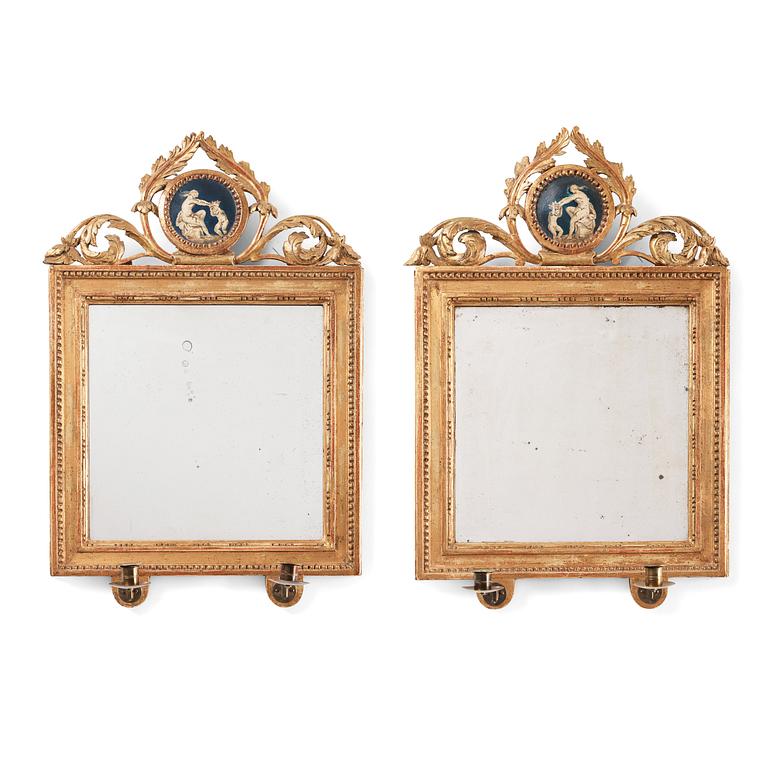 A pair of Gustavian two-light girandole mirrors by Lago Lundén active in Stockholm 1773, dead 1819).