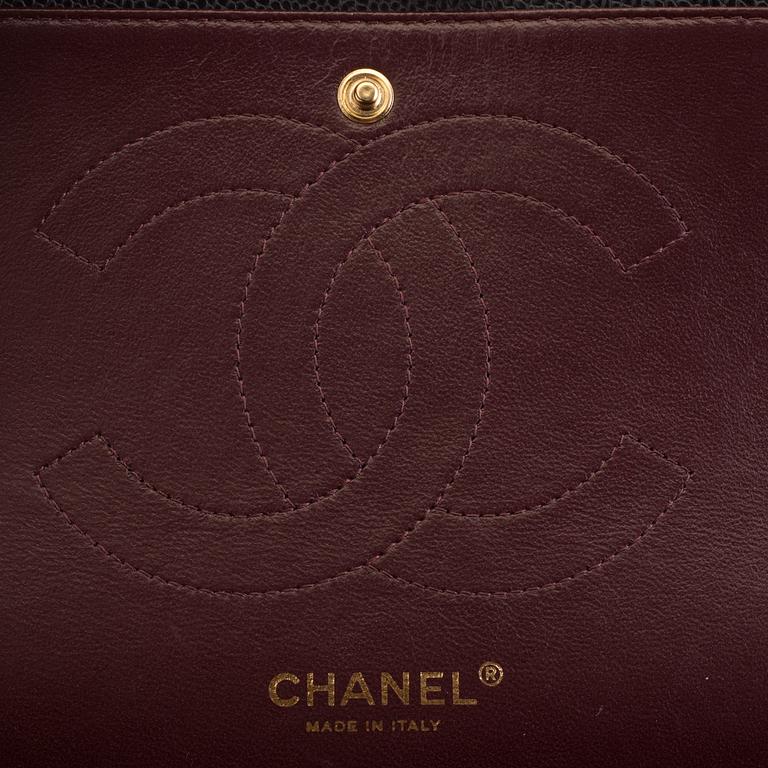 A "Double flap bag maxi" by Chanel 2015-16.