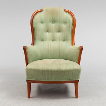 A "Vår Fru" lounge chair by Cral Malmsten.