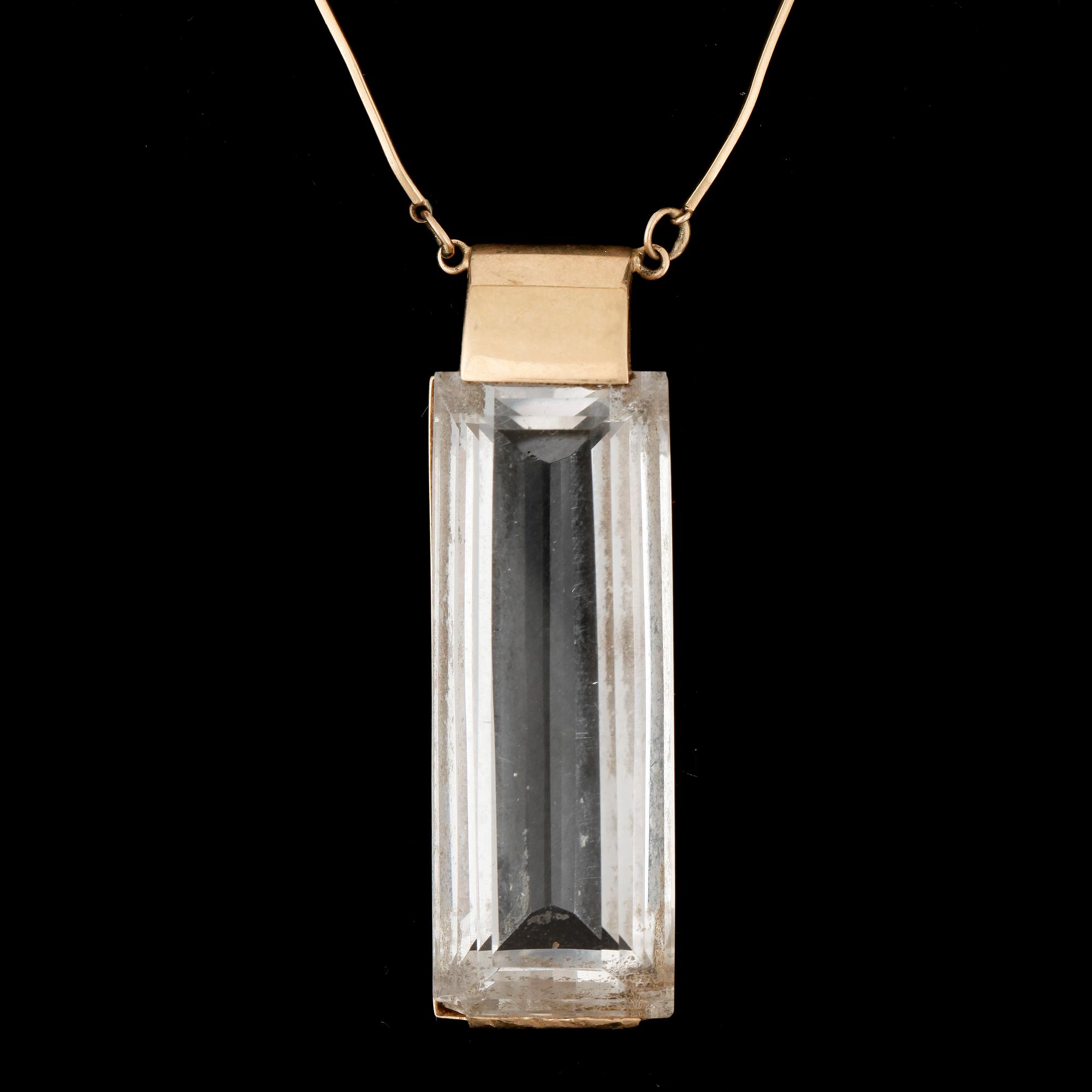 HALSSMYCKE, 18k guld med bergkristall, Stigbert, 1947. Totalvikt ca22g.