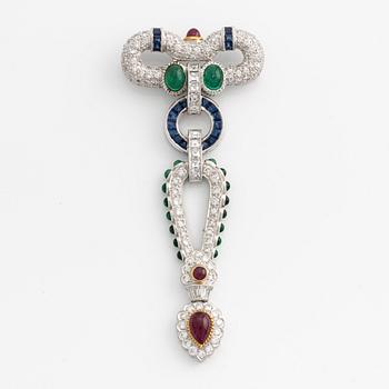 Brooch, white gold with cabochon-cut emeralds, rubies, sapphires, and brilliant- and square-cut diamonds.