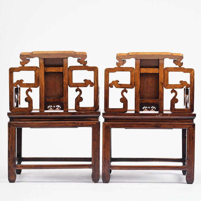 A pair of hardwood armchairs, late Qing dynasty.