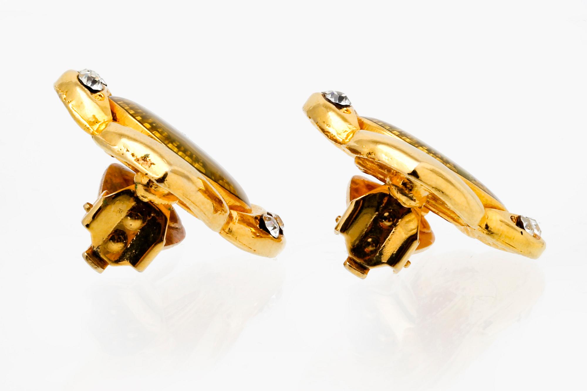 Chanel, earclips, metal, plastic and paste, approx 2,5 cm.