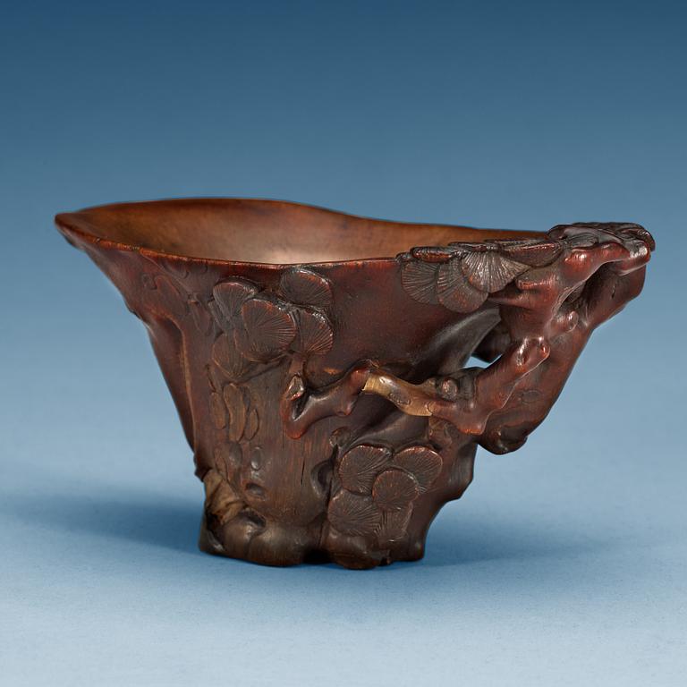 A rhinoceros libation cup, Qing dynasty, ca 1700.