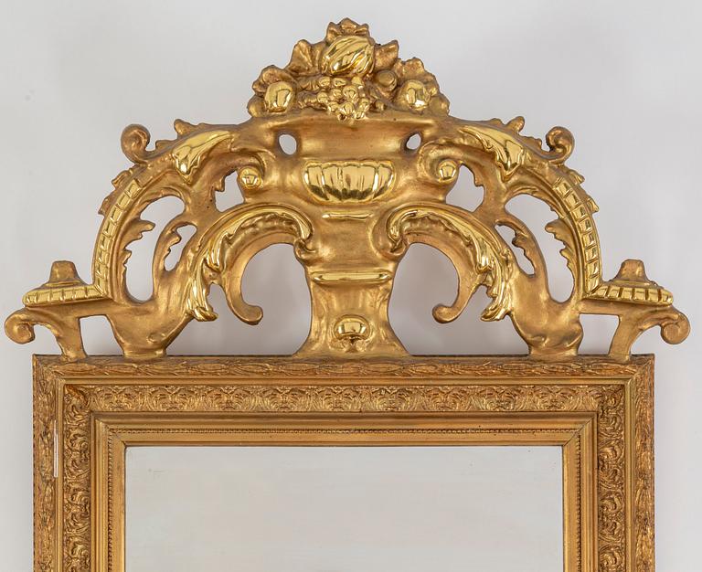 A second half of the 20th Century rococo style mirror with a console table.