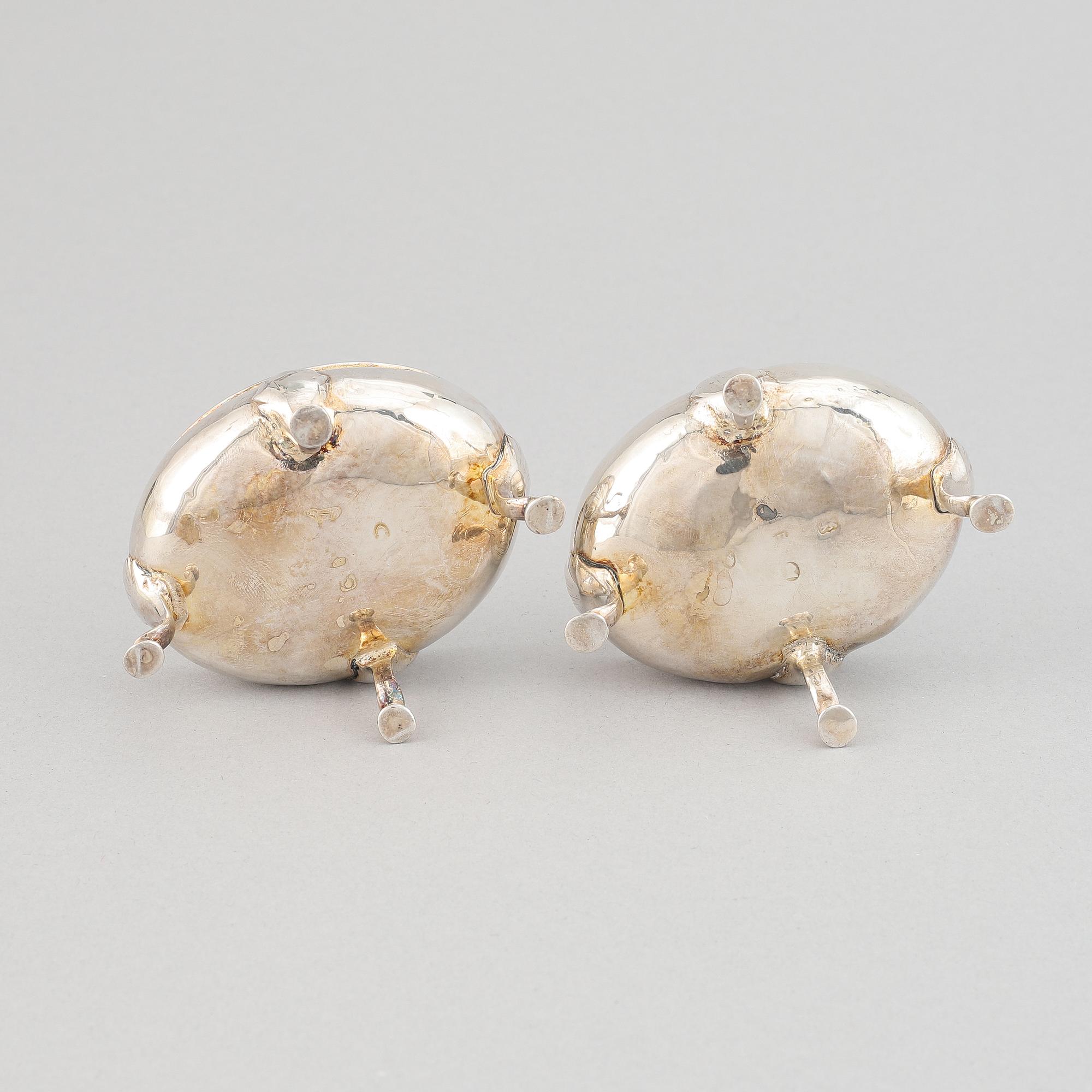 A pair of silver saltcellars, London, England.