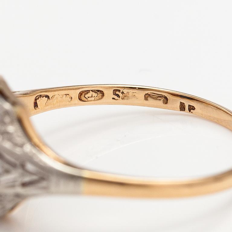 A 14K gold ring with diamonds ca. 0.02 ct in total and a sapphire. Finnish import marks.