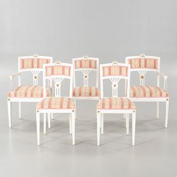 Two gustavian style armchairs and three chairs, first half of the 20th century.