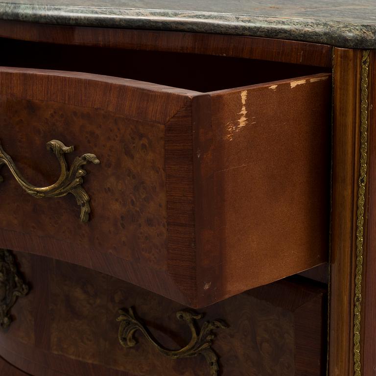 A 20th century rococo style chest of three drawers.