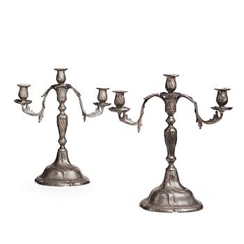 111. A pair of Swedish Rococo pewter three-light candelabra by Anders Wetterquist, Stockholm 1774.
