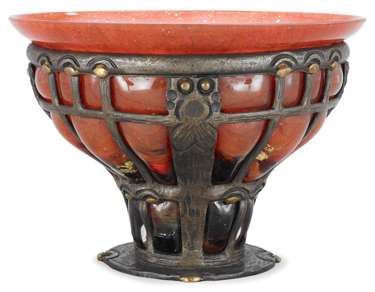 A Louis Majorelle orange glass bowl, Daum, Nancy, contained in an iron latticed frame, signed underneath.