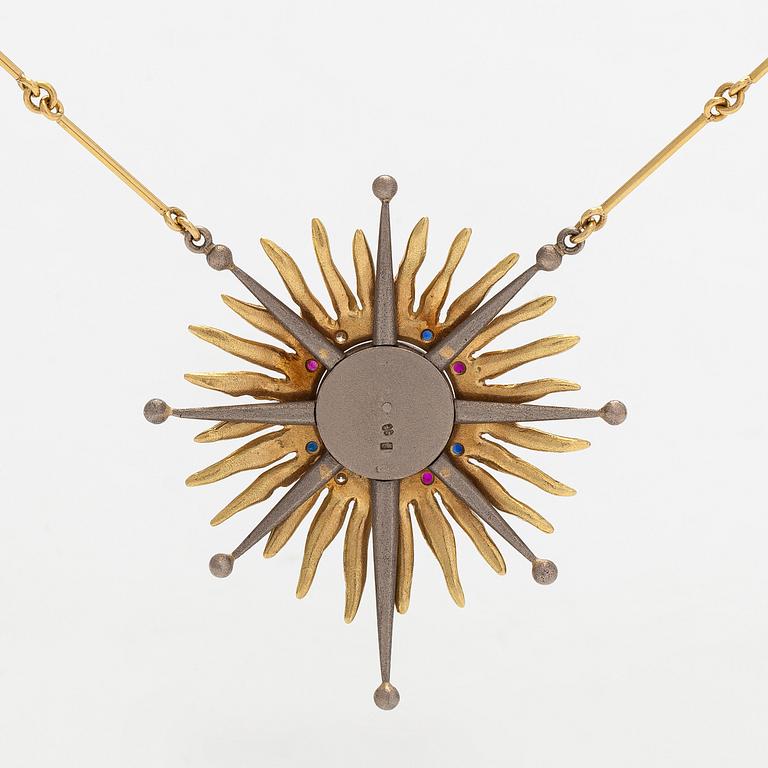 Pendant, faceted sapphires, rubies and diamonds, iron ore, 18K gold and white gold.