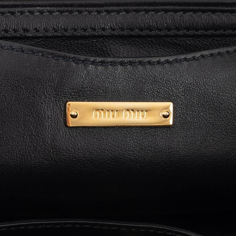 Miu Miu, a black leather handbag.