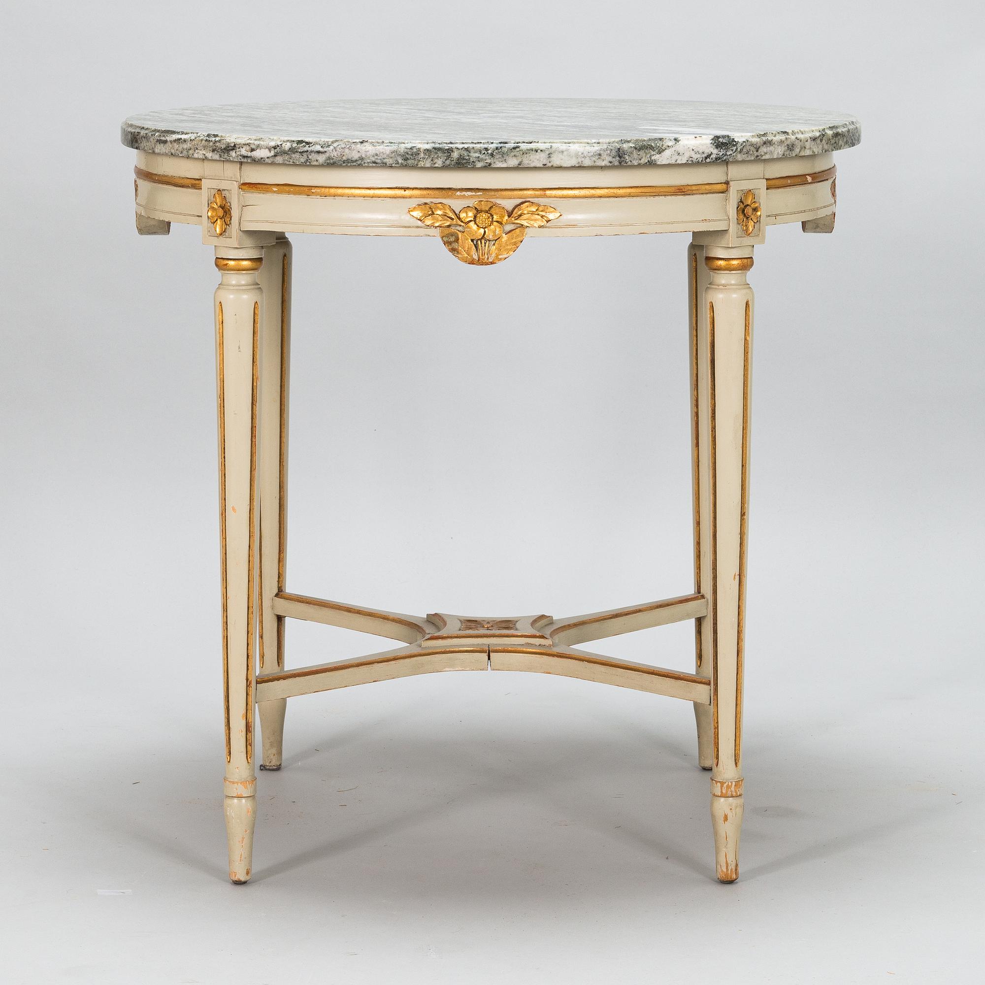 A Gustavian style sofa and table from early 20th century.
