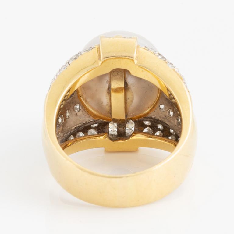 Cultured pearl and brilliant cut diamond ring.