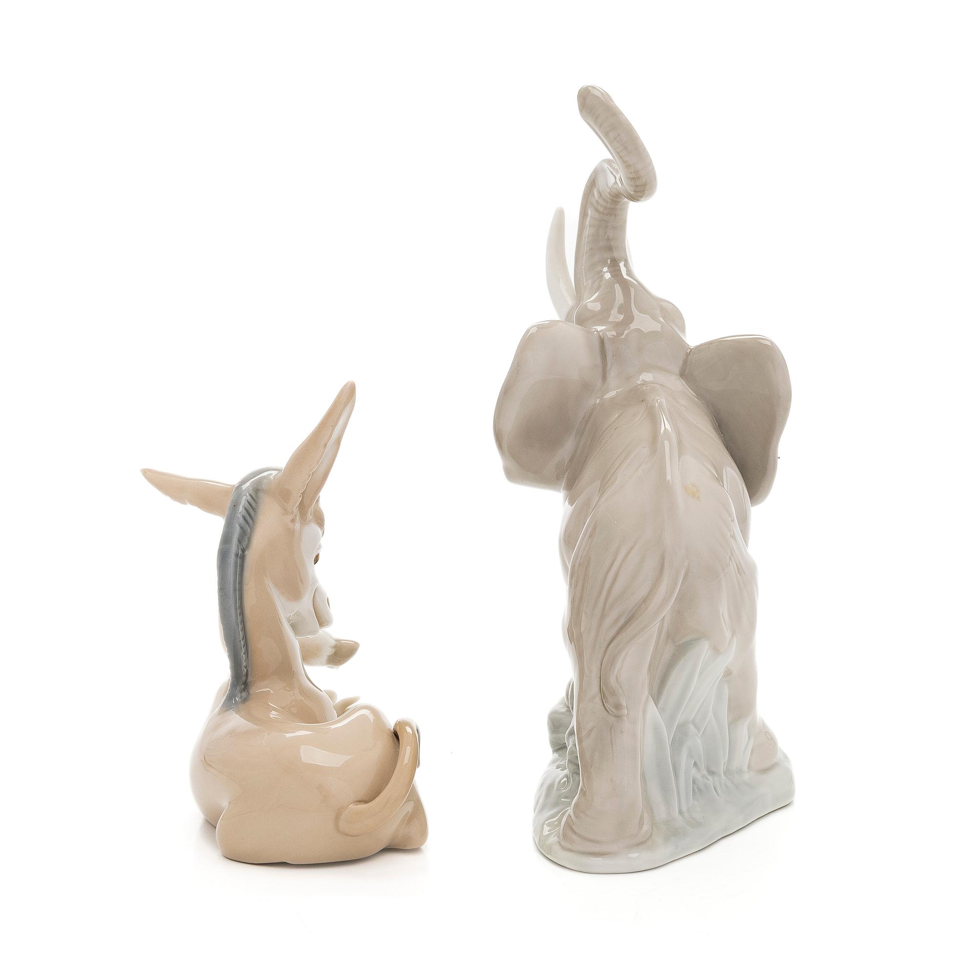 Lladró, two porcelain figurines, Donkey in Love and Trumpeting Elephant.