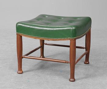 A Josef Frank green leather and mahogany stool, Firma Svenskt Tenn.