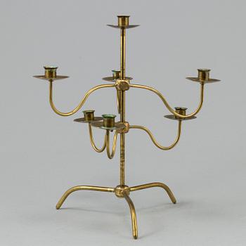 A brass kandelabra model 2454 by Josef  Frank for Firma Svenskt Tenn.