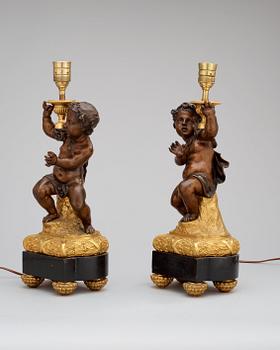 A pair of Louis XVI-style circa 1900 table lamps.