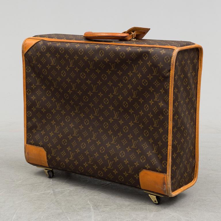 LOUIS VUITTON, a monogram canvas suitcase on wheels.