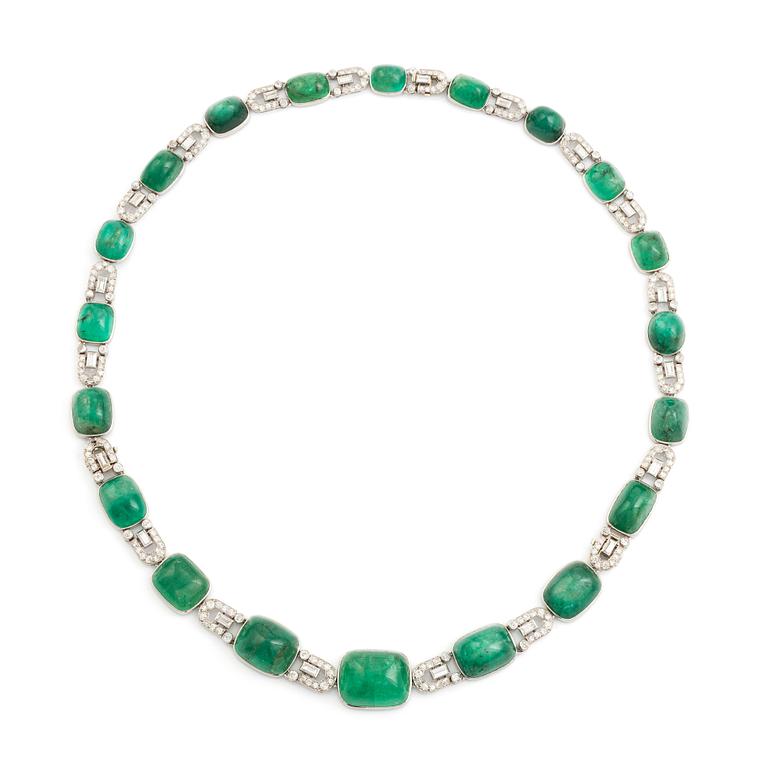 An art deco platinum necklace/bracelet combination with cabochon-cut emeralds.