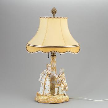 a rococo-style porcelain table lamp from the first half of the 20th century.