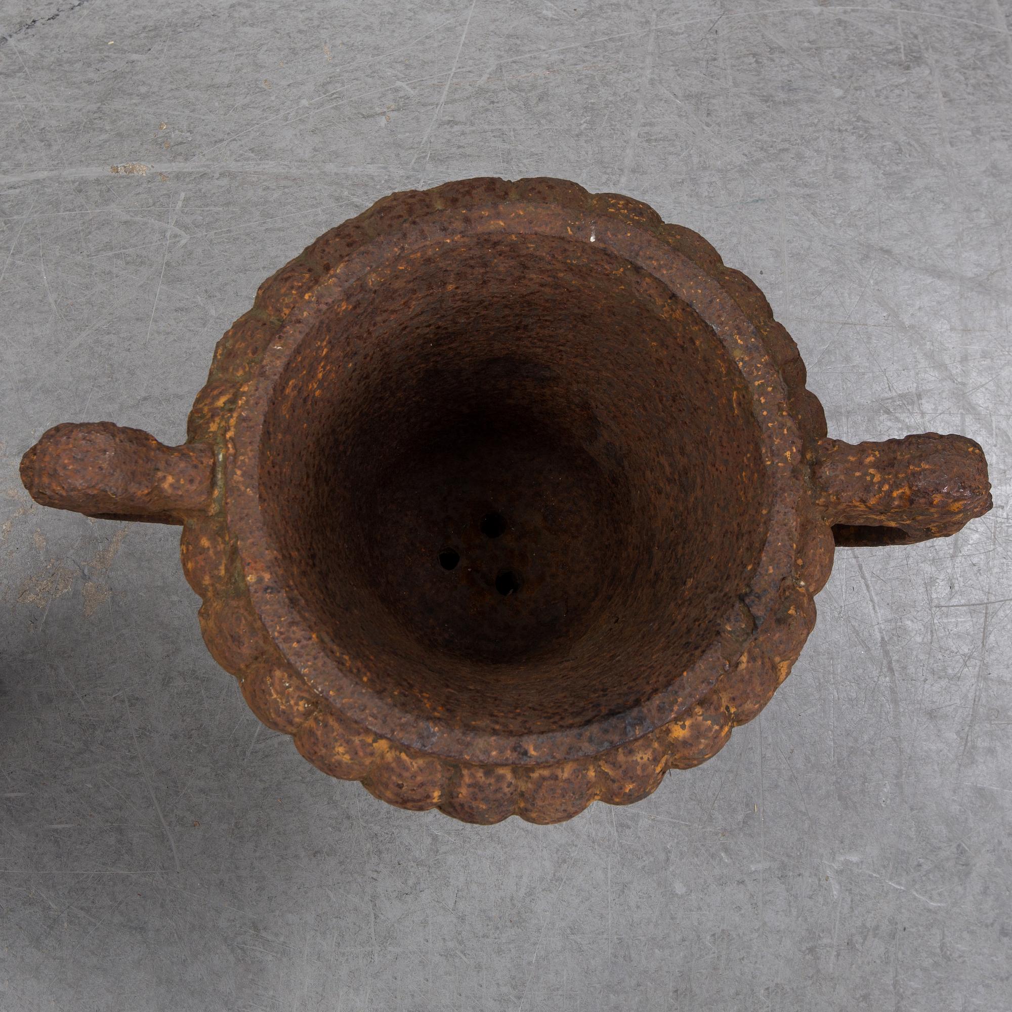 Two 19th century cast iron urns.