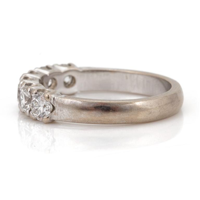 A half-eternity ring set with round, brilliant-cut diamonds.