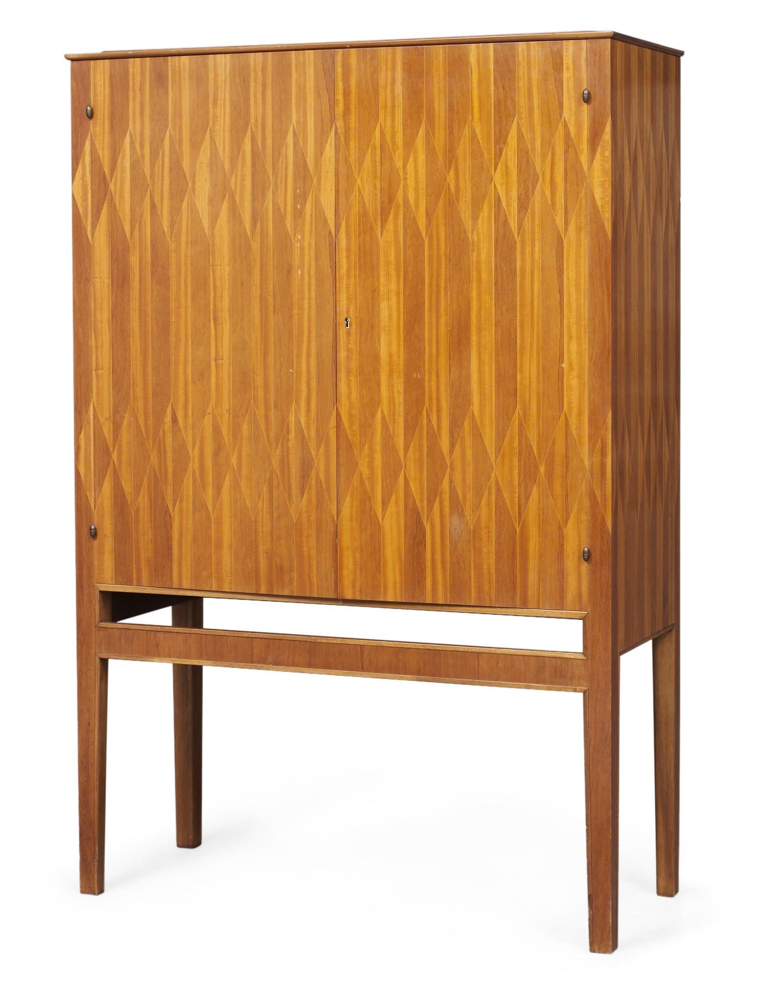 An Oscar Nilsson mahogany cabinet, executed by Wickman & Nyberg, Stockholm 1937.