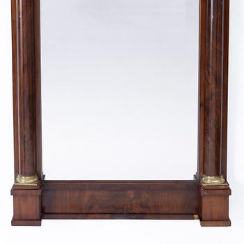 A Late Empire style mirror with a console table, second half of the 19th century.