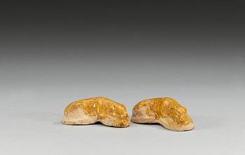 43. Two yellow glazed figures of dogs, Tang dynasty (618-907). (2).