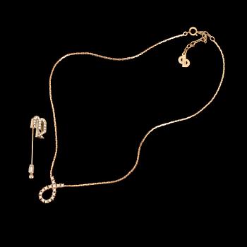 542. CHRISTIAN DIOR, broschnål samt halsband, 1980-tal.