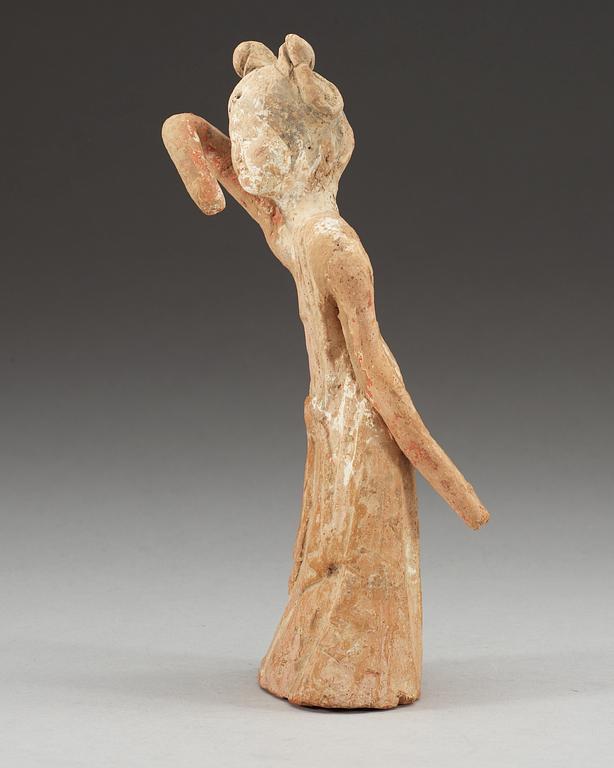 A potted figure of a dancer, Tang dynasty (618-907).