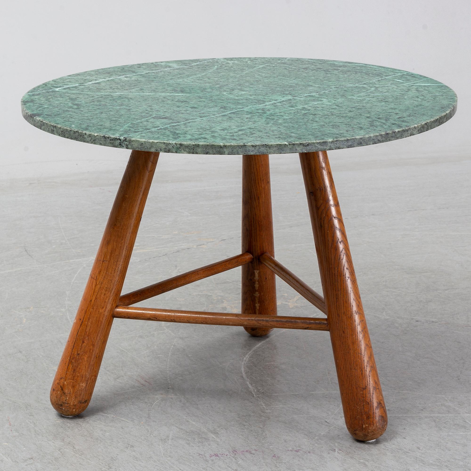 A late 20th century stone and wood coffee table.