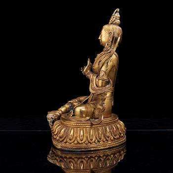 A large gilt bronze figure of Tara, with Qianlong mark.