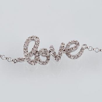 ARMBAND, 18K vitguld med briljantslipade diamanter ca 0.22 ct. Vikt 1,6 gram.