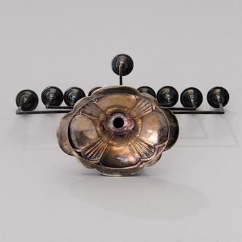 A chanukiah / menorah silver candelabrum for nine candles, mark of Britton, Gould & Co, Birmingham 1933.