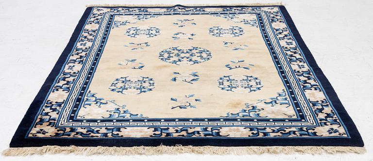 A semi-antique chinese rug, c. 195 x 132 cm .