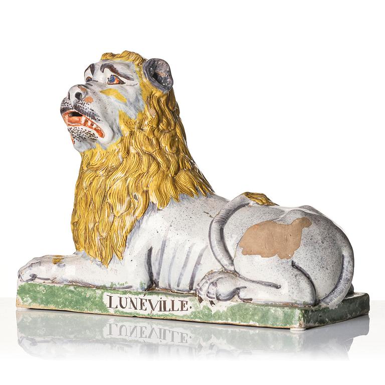 A pair of Luneville recumbent lions, circa 1780-1800.