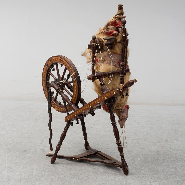 A 19th century spinning wheel.