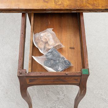 A rococo parquetry games table, later part of the 18th century.