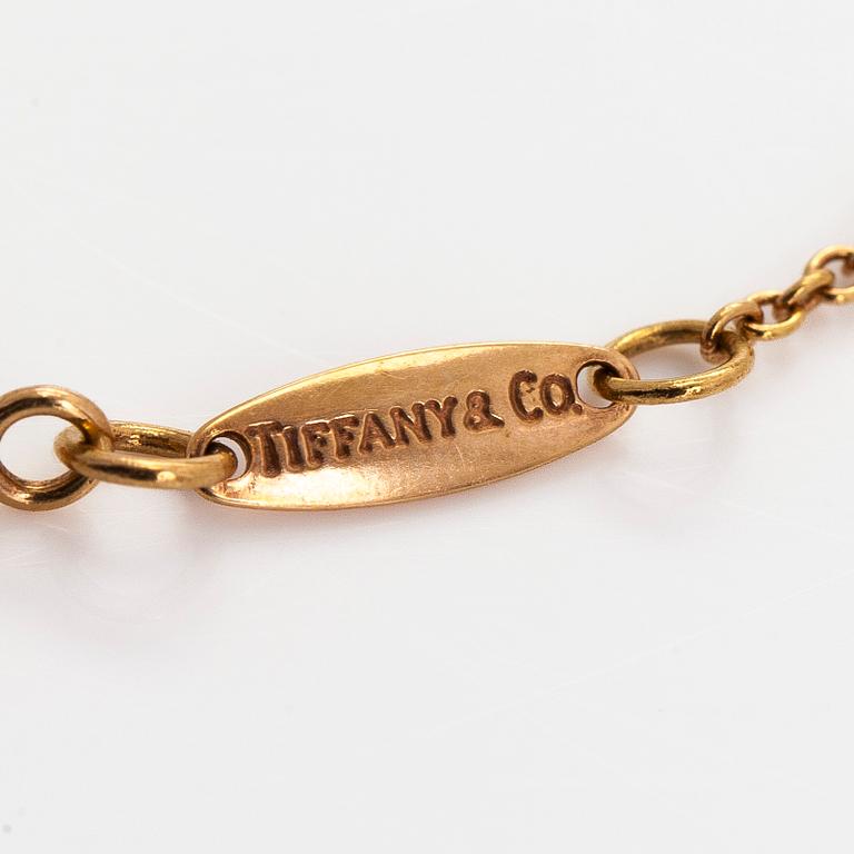 Tiffany & Co, Elsa Peretti, an 18K gold bracelet, 'Diamonds by the Yard', with a diamond approximately 0.08 ct.