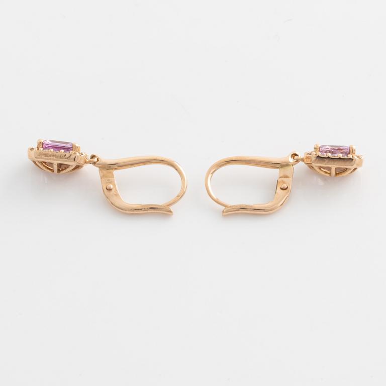 Earrings with pink sapphires and diamonds.