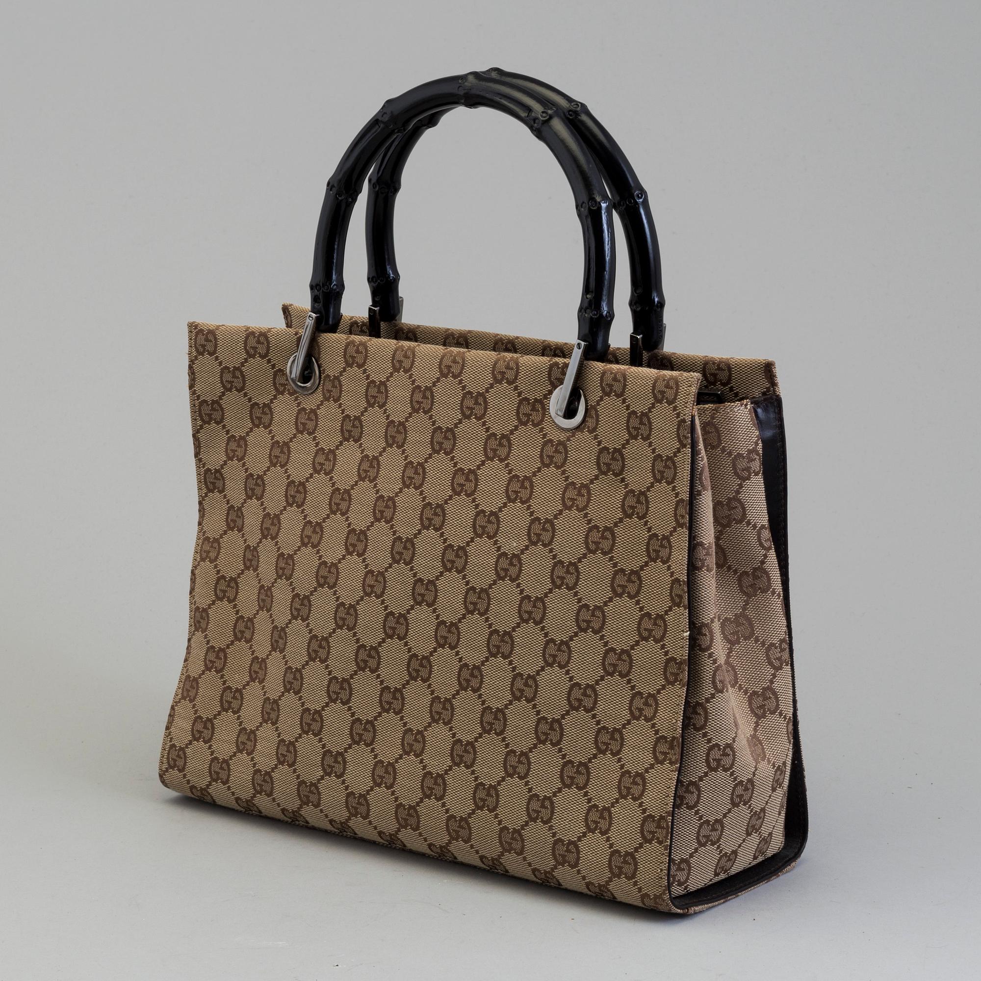 GUCCI, a monogram fabric hand bag and beauty bag.